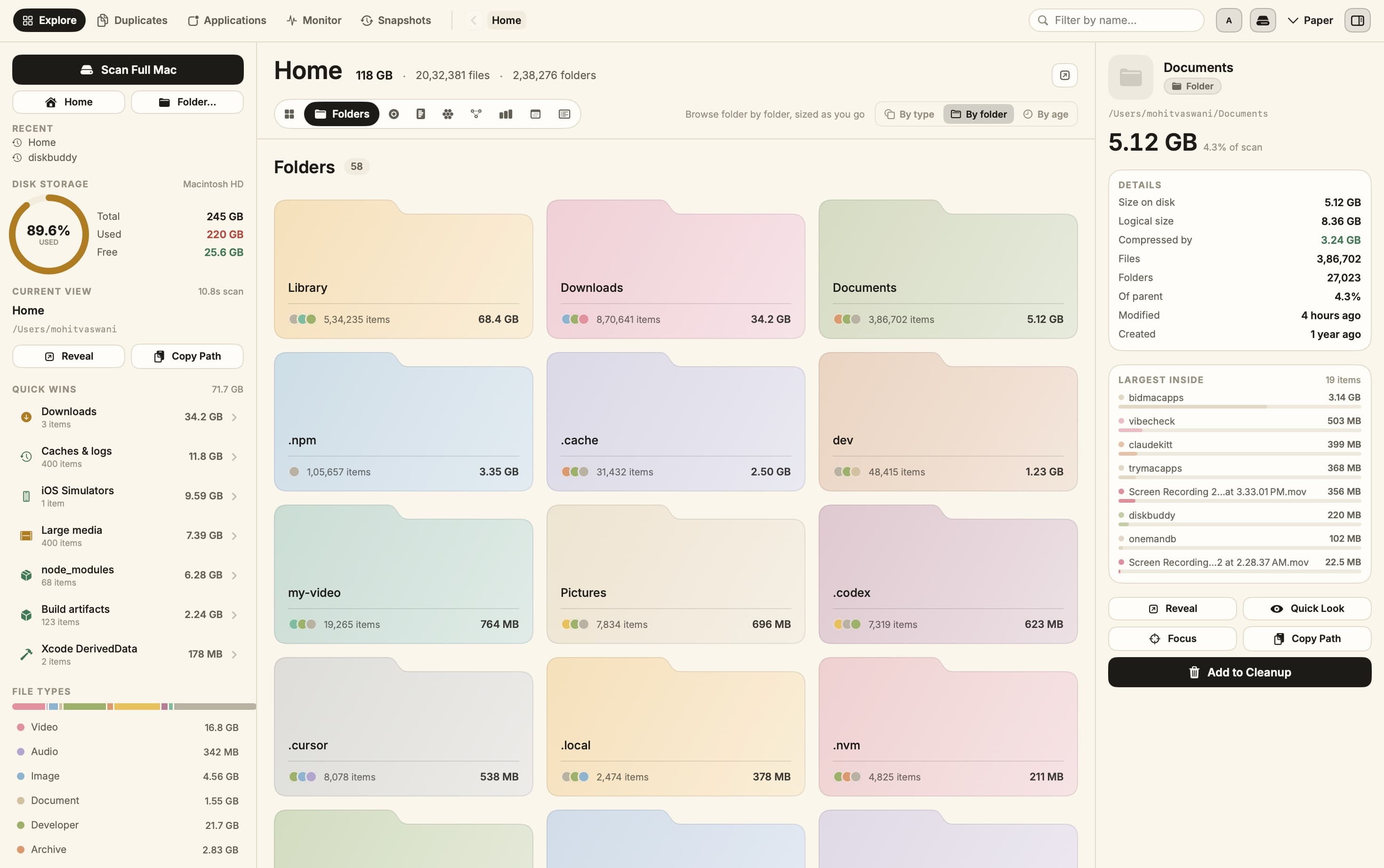DiskBuddy folder grid showing Library, Downloads and Documents as pastel folder cards with sizes.